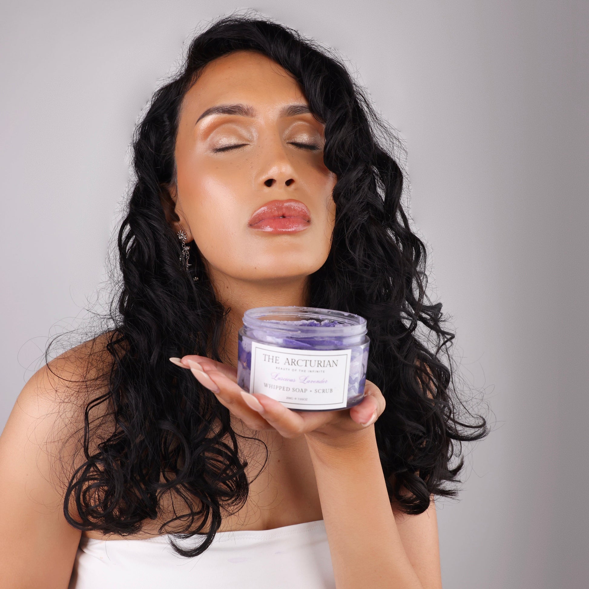 woman smelling The Arcturian Lavender Whipped Scrub