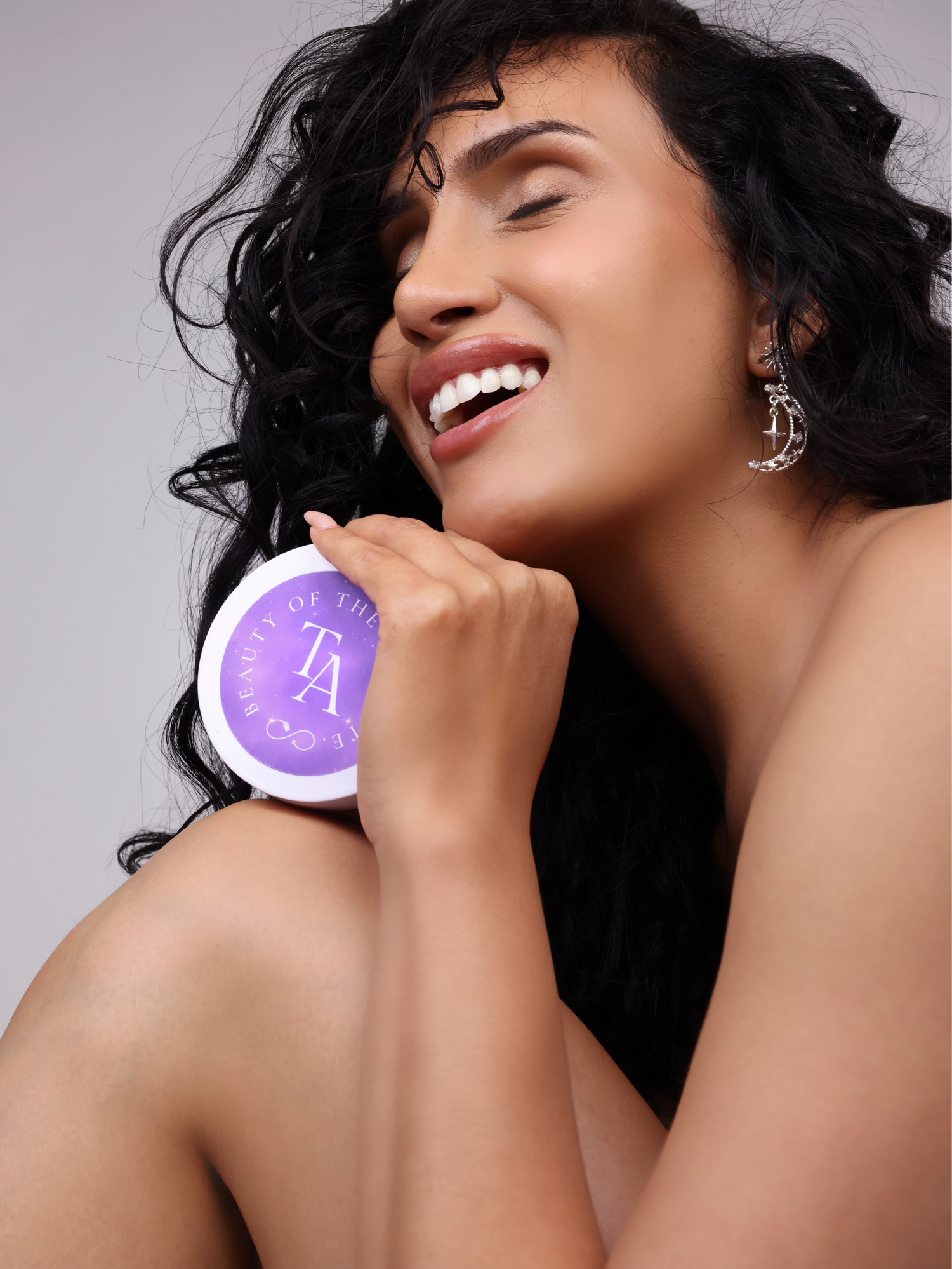 woman laughing while holding The Arcturian Lavender Whipped Scrub