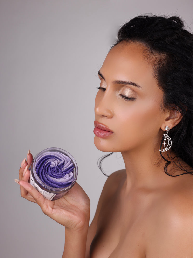 Model holding The Arcturian Lavender Whipped Scrub