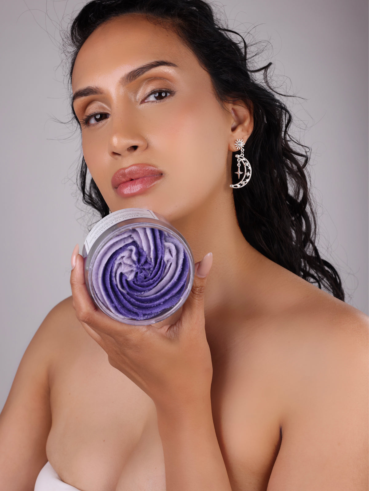 model holding The Arcturian Lavender Whipped Scrub 